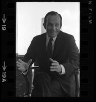 Daniel Ritchie, executive vice president-finance of MCA sits during an interview with himself and President/CEO Lew Wasserman. C. 1969
