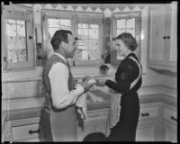 Boxer Jimmy McLarnin and his wife, Lillian, do the dishes, Beverly Hills, 1936