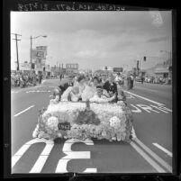 Royal court on float in Camellia Festival Parade in Temple City, Calif., 1962