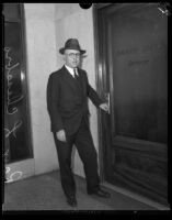 Raymond L. Chesebro, city attorney, at the entrance to the Grand Jury ...