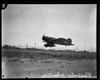 Art Goebel's monoplane, Yankee Doodle, in flight, circa 1928