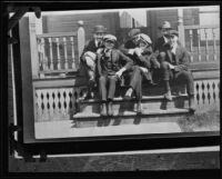 Actor Clark Gable as a young man with group of young men on porch, [Ohio?], [1920s?]