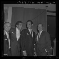 Sandy Koufax flanked by Frank Sinatra and Dean Martin at event naming Koufax pitcher of the year, 1963