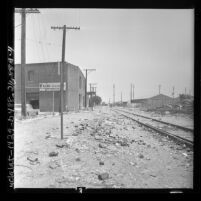 Railroad track running behind Friend Furniture Corp. building on 29th Street in Los Angeles, Calif., 1962