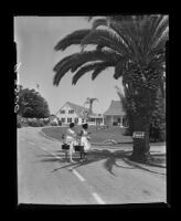 Ventura School for Girls parolees leaving the school's grounds, 1955
