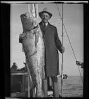 California State Senator Ed Fletcher poses with his catch in the Gulf of California, Mexico, 1935