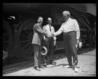 Southern Pacific officials R.E. Kelly, A.M. Merton, and W.H. Whalen with "Prosperity Special" train, Los Angeles, 1922