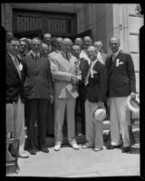 Postmaster-General Farley, Senator McAdoo, and others, possibly at Warner Brothers' Studios, California, 1934