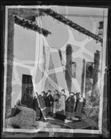 Father Arthur John Hutchinson leads a tour group of women at Mission San Juan Capistrano, San Juan Capistrano, 1937