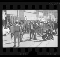 Police restraining UCLA students during Chicago Seven protest march in Westwood, Calif., 1970