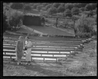 Two women standing next to bleechers at Inglewood Bowl, Centinela Park, Inglewood, 1935