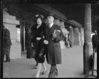 Newton D. Baker, former Secretary of War, and daughter Elizabeth Baker McGinn walking together, [Los Angeles?], 1927