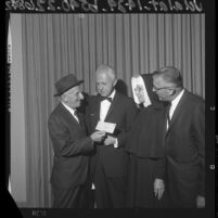 Jimmy Durante presenting check to St. John's Hospital administrators Santa Monica, Calif., 1964