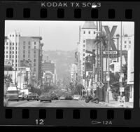 Buildings and traffic on Hollywood Blvd. near Bronson Street in Hollywood (Los Angeles), 1986