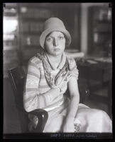 Eunice Pringle showing an abrasion on her arm received when attacked by Alexander Pantages, Los Angeles, 1929