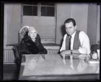 Consuela Blevins seated next to a Los Angeles policeman, Los Angeles, 1931