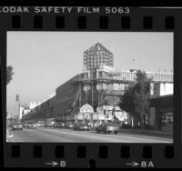 View from across Pico Blvd. at construction of tower and skylights for Westside Pavilion in Los Angeles, Calif., 1985