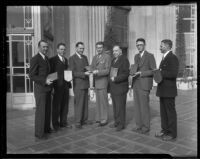 Winners of the March of Progress Realty Sales contest William G. Dickinson, Fred B. Palmer, H. Gordon Moore, B. W. Tye, John A. Ash and Edward J. Partridge given out by the Times' own Mr. Norman Chandler, center, Los Angeles, 1936