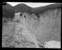 Side view of the remaining center portion of the St. Francis Dam visible after its disastrous collapse, San Francisquito Canyon (Calif.), 1928