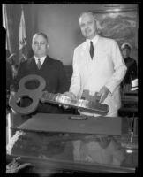 Los Angeles Mayor Frank Shaw presenting or receiving a key to the city, Los Angeles, 1933-1938