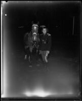 Woman lancer beside her horse, Los Angeles, 1930s