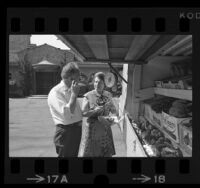 Door to door produce vendor, John Musante visiting customer in Bel-Air, Calif., 1971