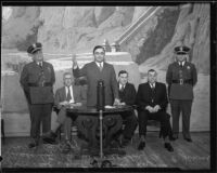 Los Angeles County sheriff Eugene Biscailuz and other county officials in front of mural, [1930s?]