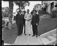 Assailant William Hardy surrounded by detectives, retracing the crime scene, Los Angeles, 1935