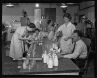 Dr. R. V. Stone, Ellen Kimberly, Carolyn Lacy, Katherine Sing, and Euring Drake analyze milk and cream, Los Angeles, 1935