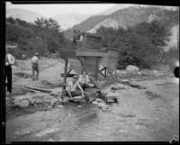 Gold miners Mr. and Mrs. Frank Robison panning for gold, San Gabriel Canyon, 1932