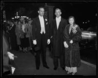 Two men and one woman on opening night of the Grand Opera at the Philharmonic Auditorium, Los Angeles, 1932