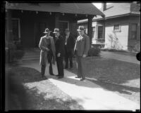 Los Angeles police detective Joe Taylor and other law enforcement officials in front of home of kidnap victim Mary B. Skeele, 1933