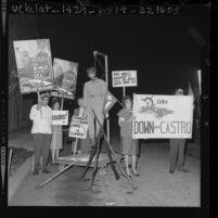 Pickets gathered around effigy of Fidel Castro during protest on Hollywood Blvd. by Cuban exiles in Los Angeles, 1963