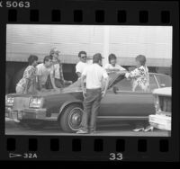 Day laborers speaking to a potential employer in Los Angeles, Calif., 1986