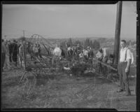 People examine the remains of the airplane that crashed, killing Ralph Wagner and Jack Kelder, Manhattan Beach, 1935