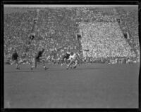 Football game between the UCLA Bruins and a Washington team at the Coliseum, Los Angeles, 1923-1939