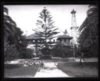 Oil wells next to a home, Inglewood, circa 1925