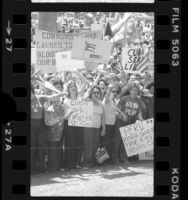 Anti-Fidel Castro demonstrators with Cuban flags and signs in Spanish and English, Los Angeles, 1980