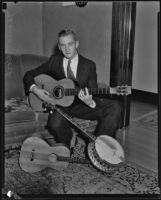 Musician James Korb with several of his instruments, Los Angeles, 1933 ...