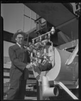 Harry Lee Martin turns a nob on the new Fuller Gold Dredge, Bakersfield, 1935