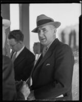 Professor Raymond T. Moley chatting with others, Los Angeles, 1933