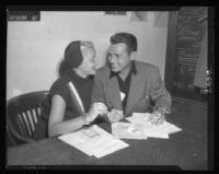 Barbara Payton and Tom Neal apply for passports at the federal building, 1952