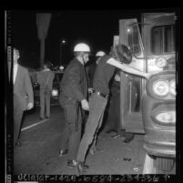 Youth being searched by police during crackdown on the Sunset Strip, Los Angeles, Calif., 1966