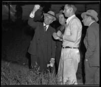 Assailant William Hardy with detectives, retracing the crime scene, Los Angeles, 1935