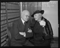 Clyda E. Willis whispering to her husband, Judge Henry M. Willis, Los Angeles, 1935
