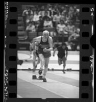 Senator Alan Cranston, age 70, doing 60-yard dash at track meet, 1985