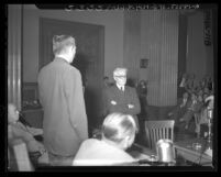 Attorney Leo Gallagher shown with arms folded during questioning in Los Angeles, Calif., 1948