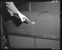 Bullet mark on Joan Bennett's Cadillac automobile, Los Angeles, Calif., 1951