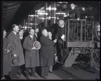 Father Jerome Ricard greets a crowd at the train station, Santa Clara, circa 1928