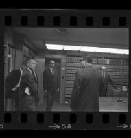 Jack Kirschke in a law office with six other men, Los Angeles, 1967